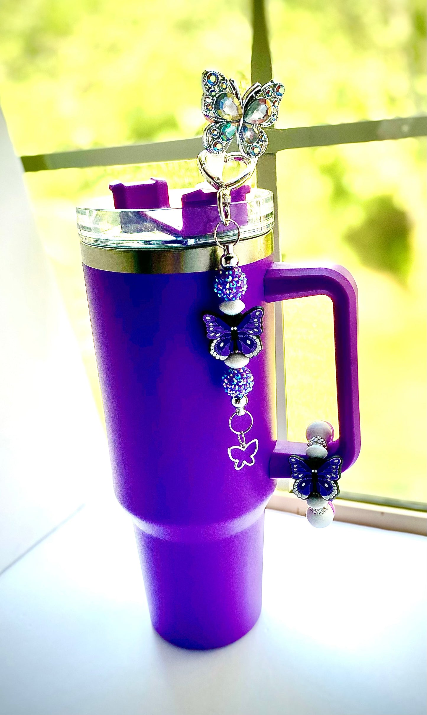 Purple insulated tumbler mug with butterfly cup charm, straw topper, and butterfly keychain from Butterfly Collection gift set