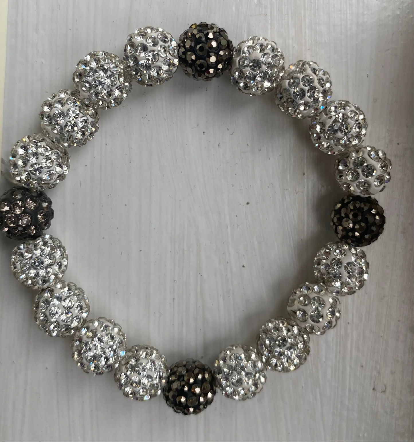 dazzling bracelet with shimmering disco ball-like beads on white surface