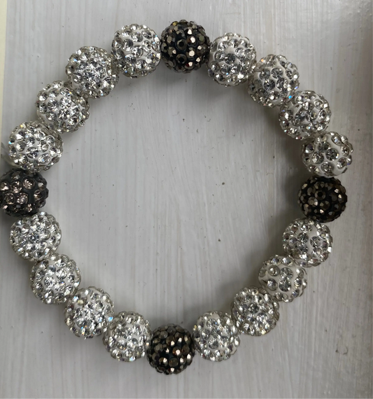 dazzling bracelet with shimmering disco ball-like beads on white surface