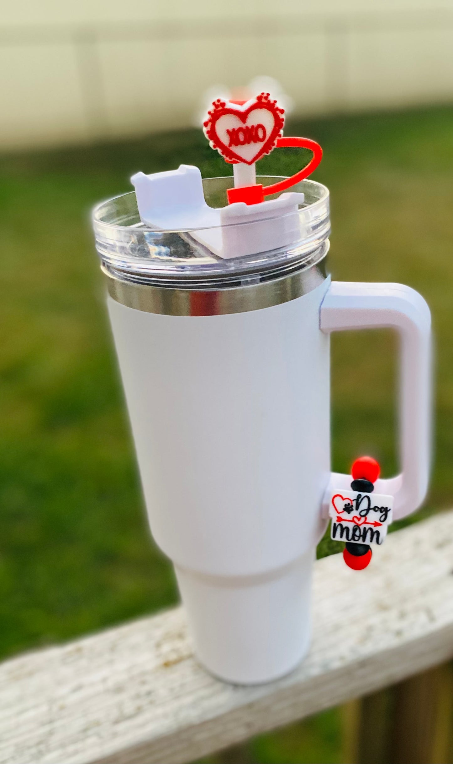 White tumbler mug with dog mom accessories including heart cup charm, straw topper, and keychain bag charm