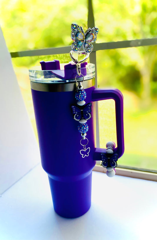 Purple travel tumbler with butterfly-themed charms from Butterfly Collection